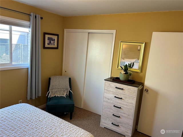 bedroom featuring dark carpet and a closet