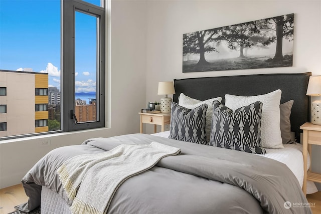 bedroom with wood-type flooring