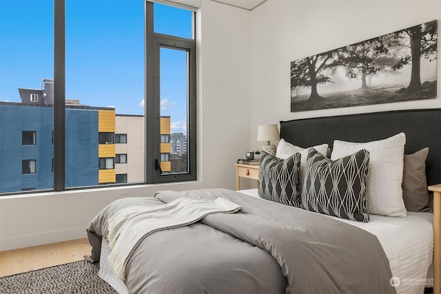 bedroom with hardwood / wood-style floors