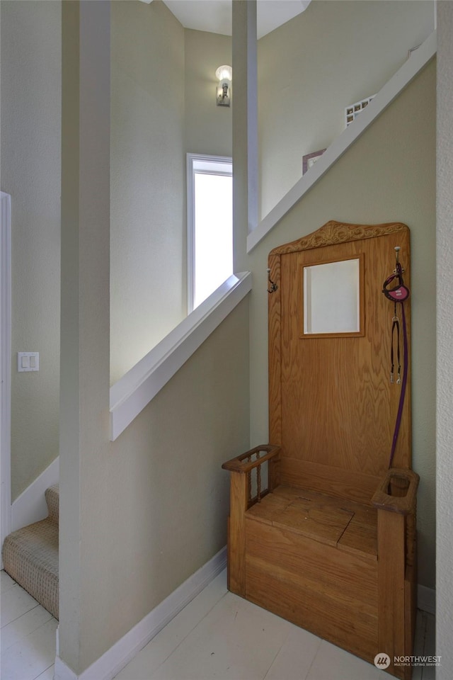 stairway with tile patterned flooring