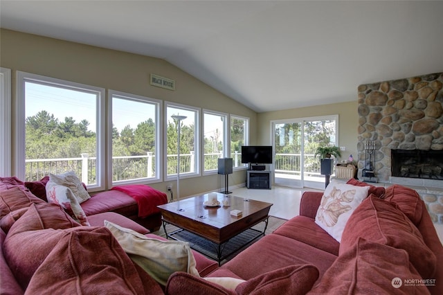 living room with a fireplace and vaulted ceiling