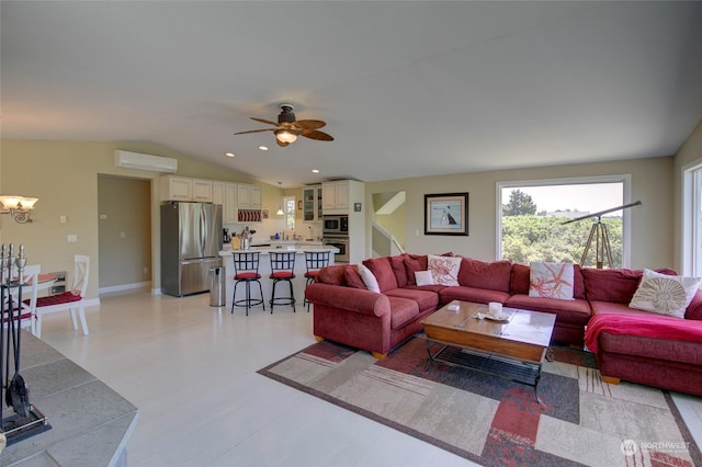 living room featuring ceiling fan with notable chandelier, a wall mounted AC, and lofted ceiling