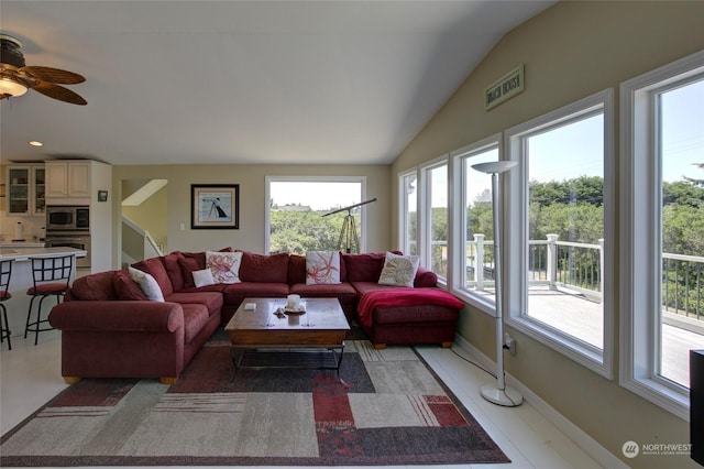 living room with vaulted ceiling and a wealth of natural light