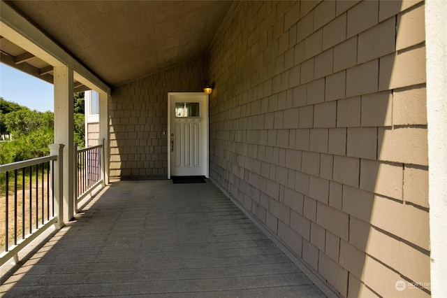 property entrance with a balcony