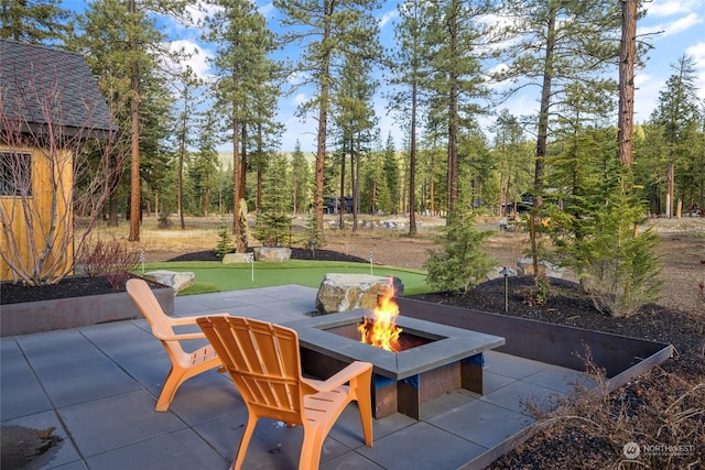1791 Wanawish Loop, Cle Elum, WA 98922 - view of patio / terrace featuring a putting area and an outdoor fire pit