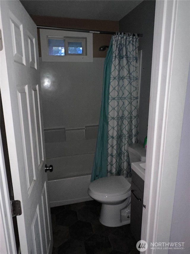 bathroom with shower / bath combo with shower curtain, toilet, vanity, and tile patterned flooring