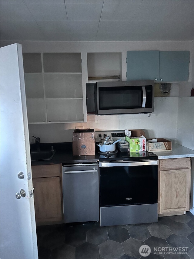 kitchen with a sink and stainless steel appliances