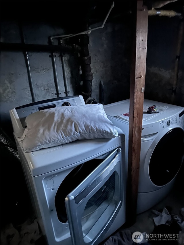 clothes washing area featuring laundry area and independent washer and dryer