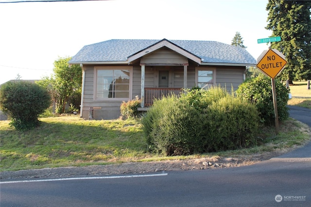 bungalow-style house with a shingled roof