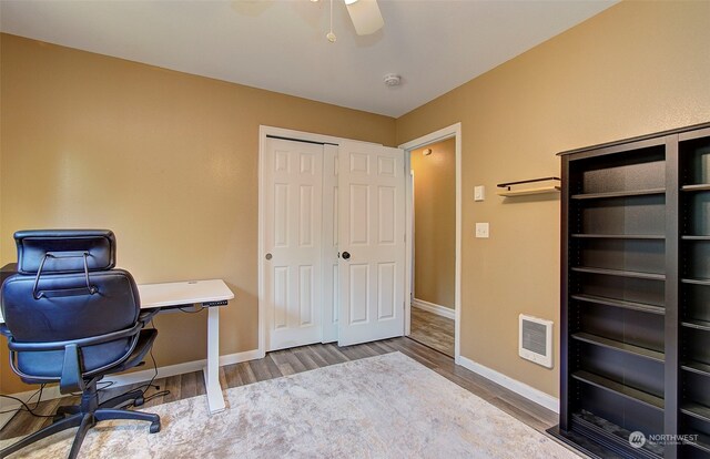 office space featuring hardwood / wood-style flooring and ceiling fan