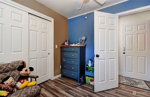 rec room with dark wood-type flooring and ceiling fan