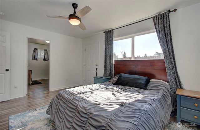 bedroom featuring wood-type flooring and ceiling fan