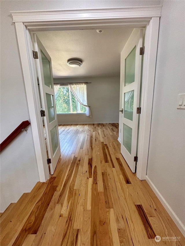 corridor featuring light wood-type flooring