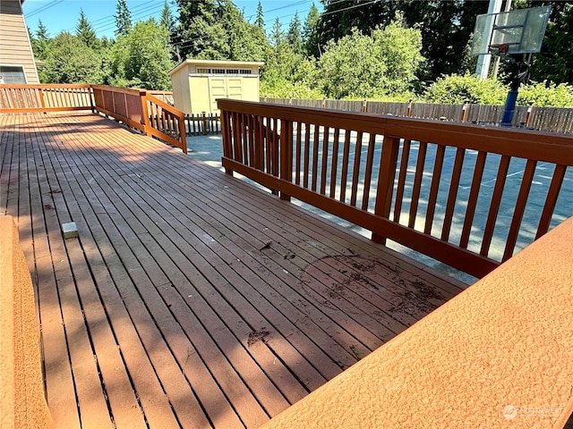 wooden terrace with a shed