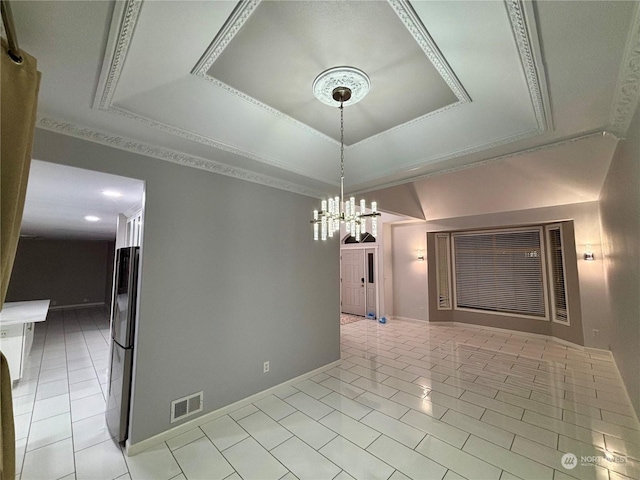 unfurnished dining area with light tile patterned floors, a tray ceiling, and a chandelier