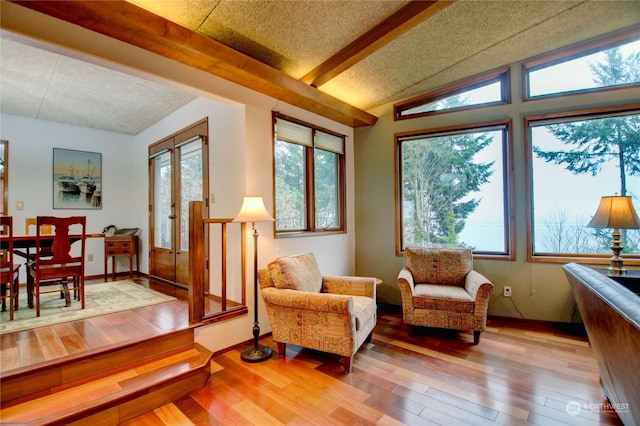3917 Mallard Point Dr, Anacortes, WA 98221 - sunroom / solarium featuring a healthy amount of sunlight, french doors, and beam ceiling