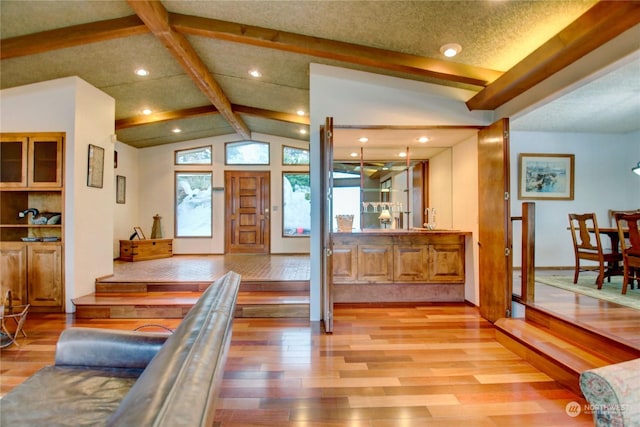 3917 Mallard Point Dr, Anacortes, WA 98221 - entryway featuring light wood finished floors, vaulted ceiling with beams, and recessed lighting