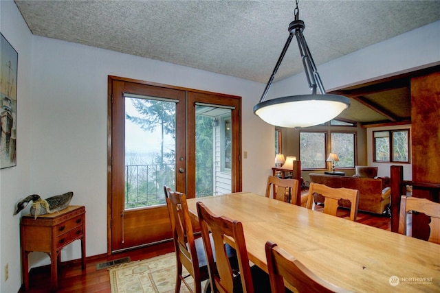 3917 Mallard Point Dr, Anacortes, WA 98221 - dining area with plenty of natural light, wood finished floors, visible vents, and a textured ceiling