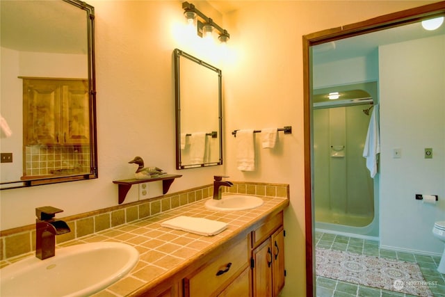 3917 Mallard Point Dr, Anacortes, WA 98221 - full bath featuring a shower stall, tile patterned floors, a sink, and double vanity