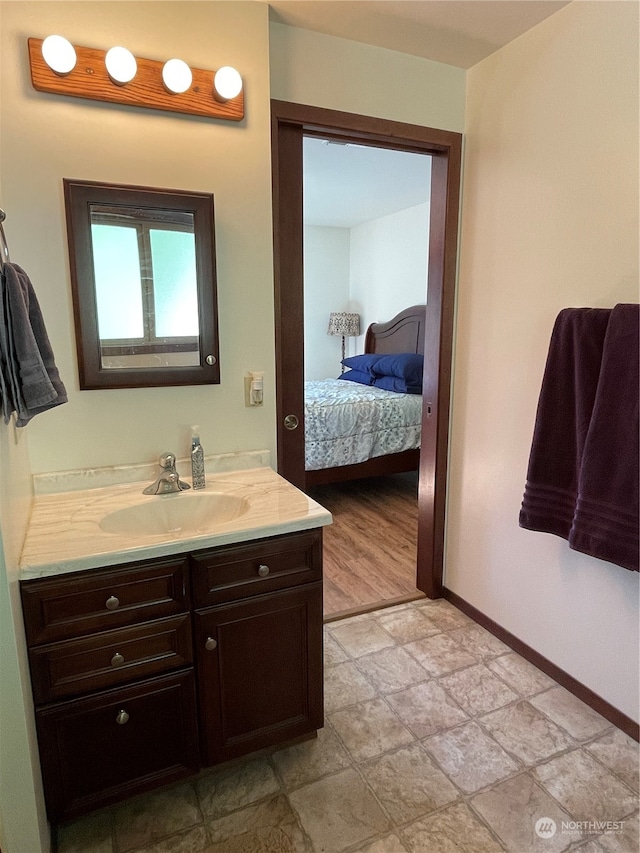 bathroom with tile patterned floors and vanity