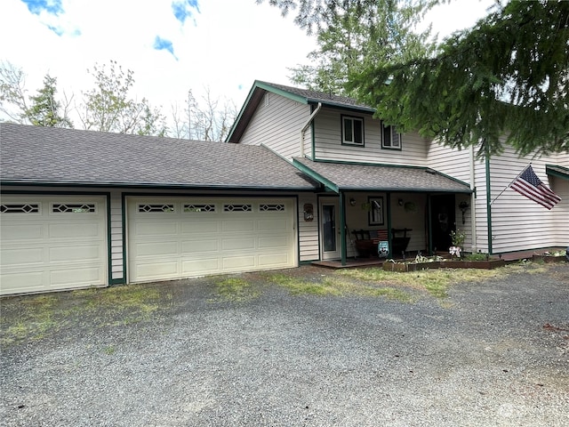 front of property with a garage