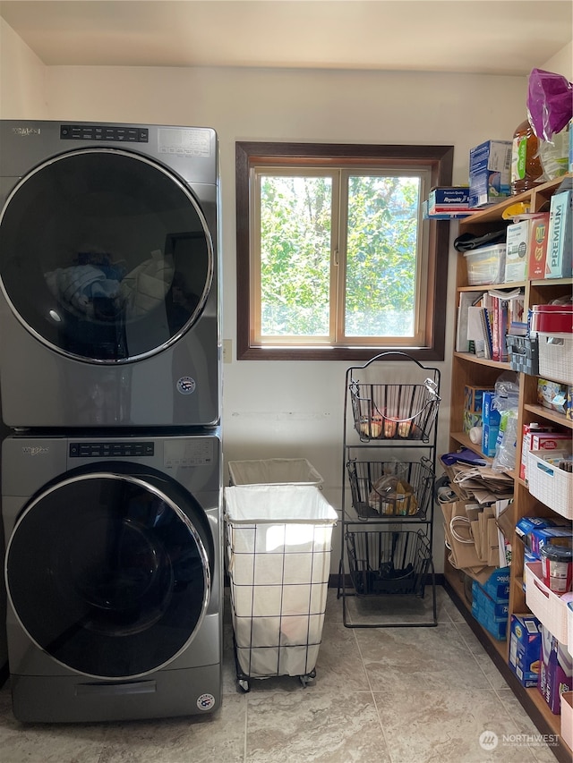 laundry room featuring stacked washer and clothes dryer