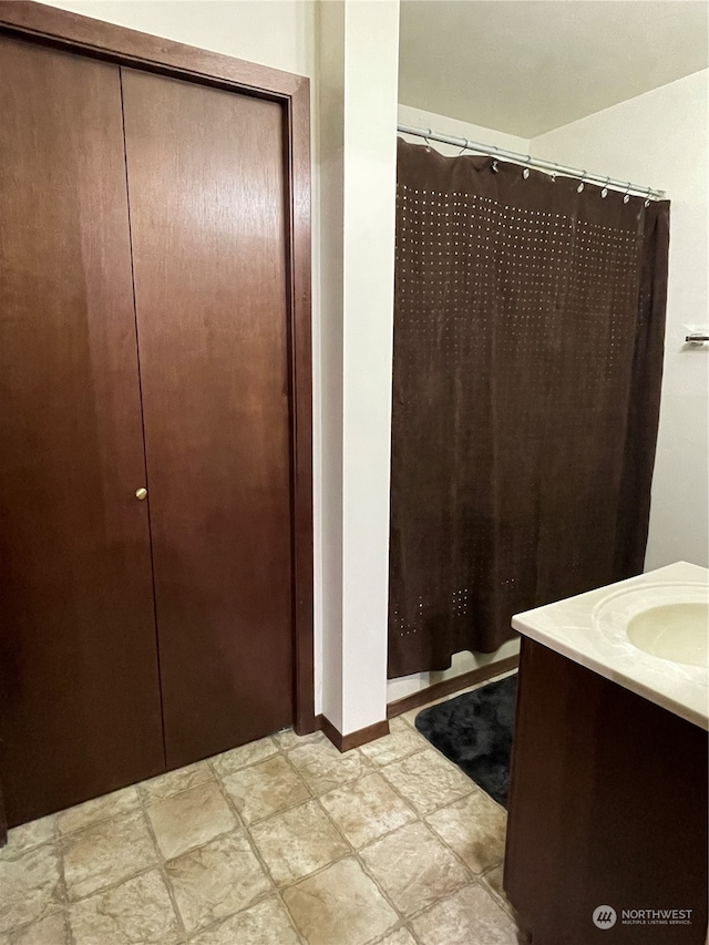 bathroom with vanity and tile patterned flooring