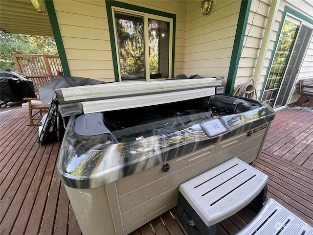 deck with a hot tub