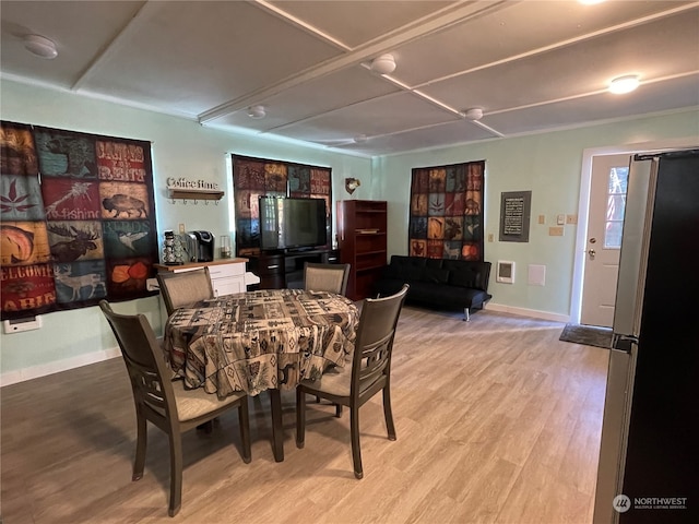 dining space featuring light hardwood / wood-style floors