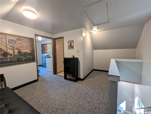 interior space featuring carpet floors and lofted ceiling