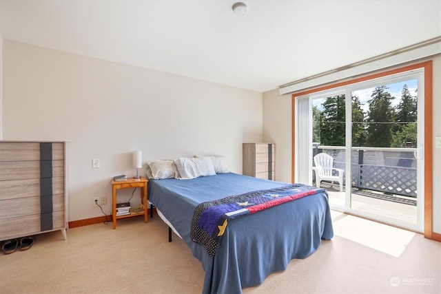 carpeted bedroom featuring access to exterior