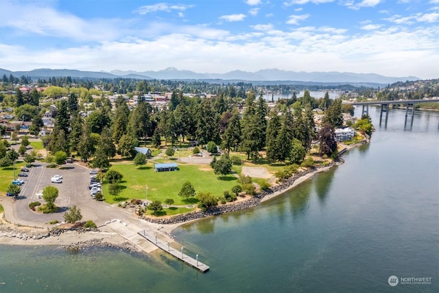 birds eye view of property with a water and mountain view