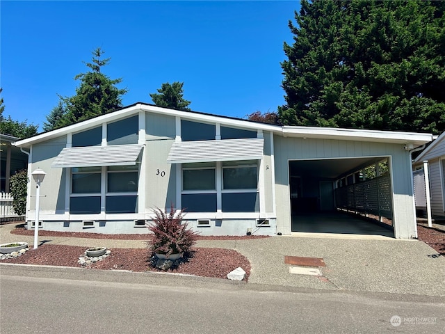 view of front facade with a carport