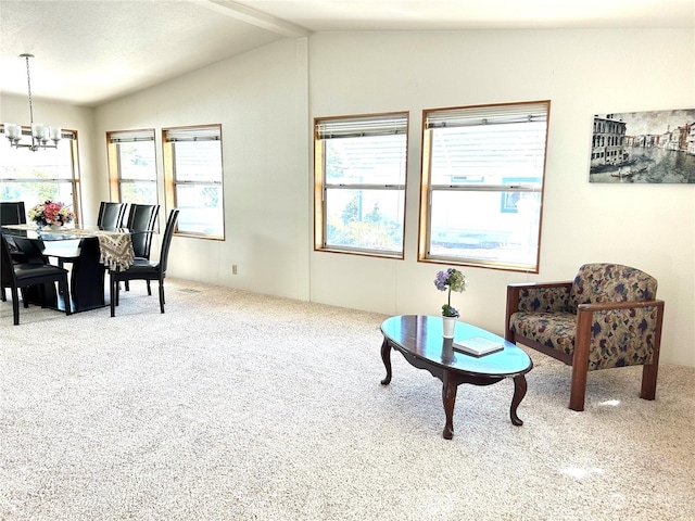 sitting room featuring an inviting chandelier, carpet floors, and lofted ceiling with beams