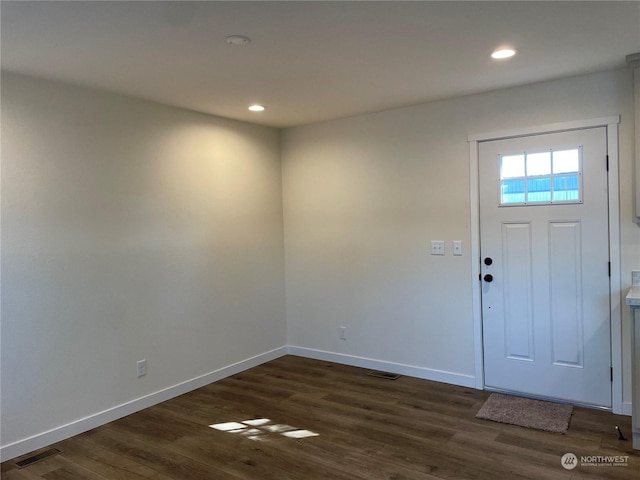 entryway with dark hardwood / wood-style floors