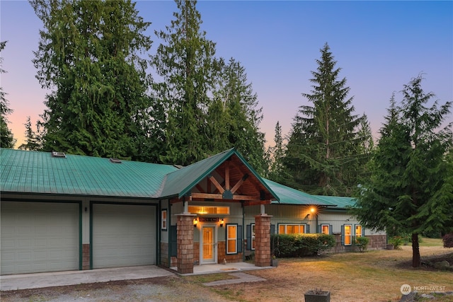 view of front of property with a garage