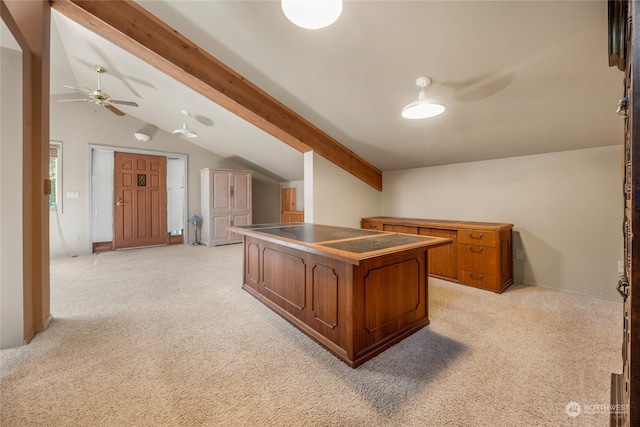 carpeted office space with lofted ceiling with beams and ceiling fan