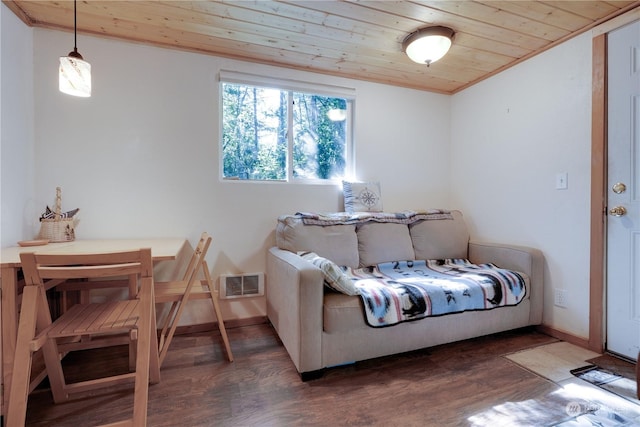 bedroom with dark wood-type flooring and wood ceiling