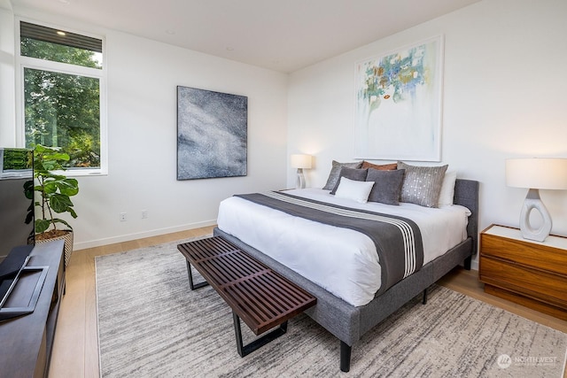 bedroom with light hardwood / wood-style floors