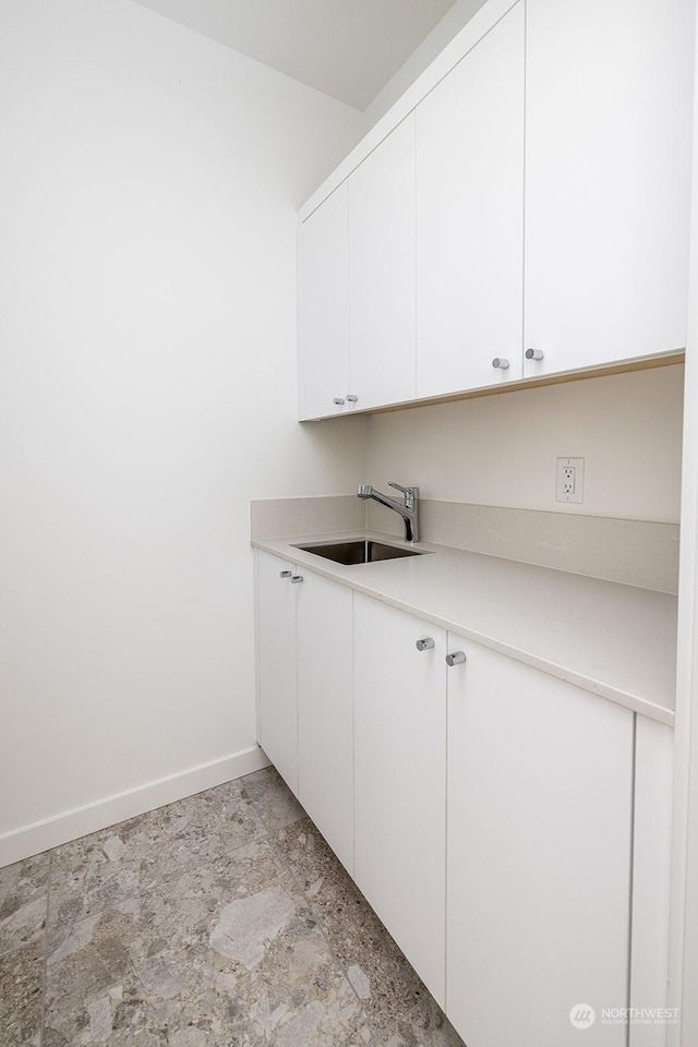 laundry area with sink