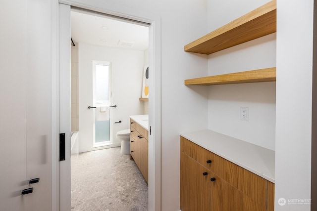 bathroom with vanity and toilet