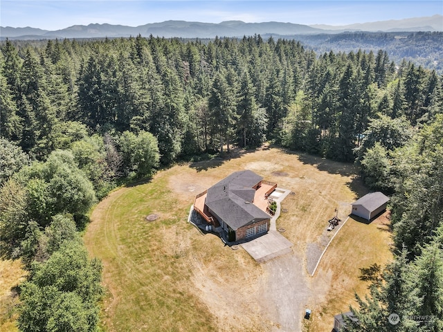 birds eye view of property with a mountain view