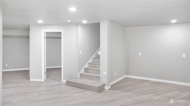 34210 206th Ave SE, Auburn, WA 98092 - basement with light wood-type flooring, stairway, baseboards, and recessed lighting