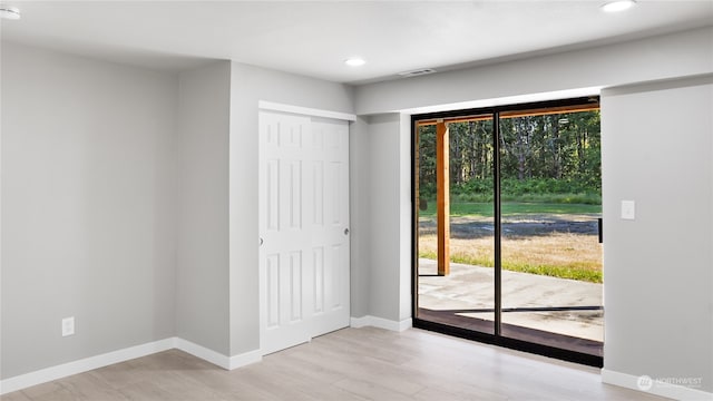 doorway with light wood-type flooring