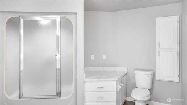 bathroom featuring toilet and vanity