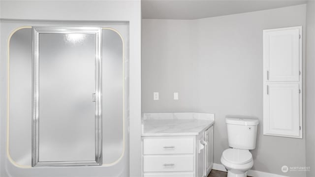 34210 206th Ave SE, Auburn, WA 98092 - full bathroom featuring a stall shower, baseboards, vanity, and toilet