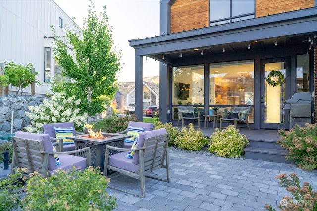 view of patio / terrace with a grill and an outdoor fire pit