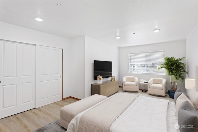 bedroom featuring hardwood / wood-style flooring and a closet