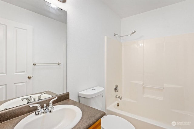 full bathroom featuring vanity, toilet, and shower / washtub combination