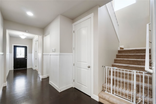 foyer with dark hardwood / wood-style floors